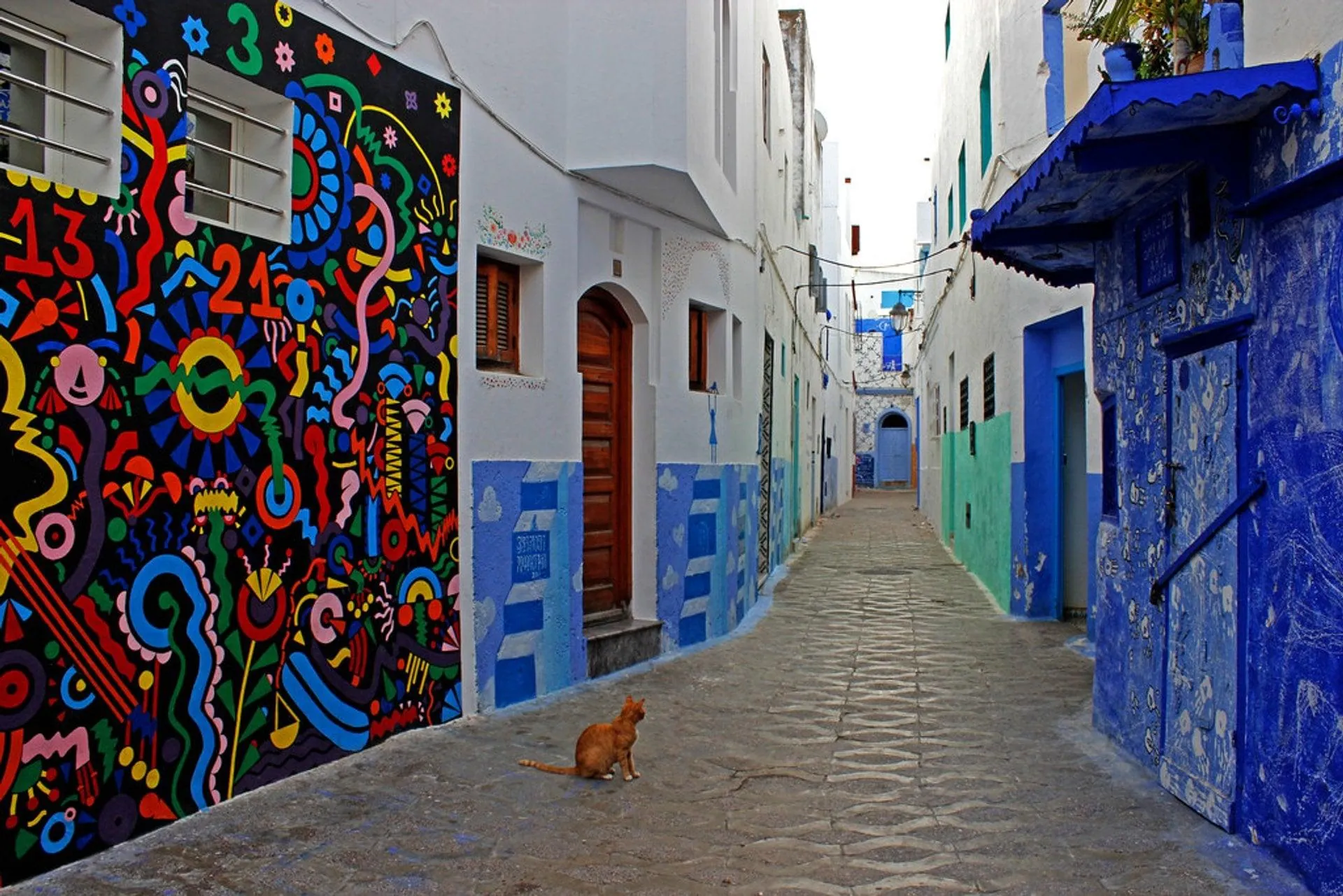 Painted walls and blue doorways in Asilah’s Medina