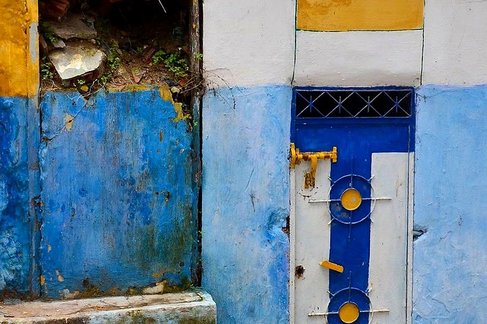 Blue painted walls and a door in the Medina