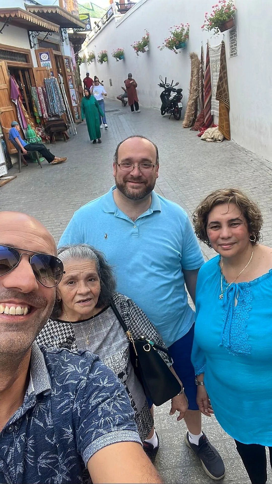 A family selfie in a whitewashed Medina lane