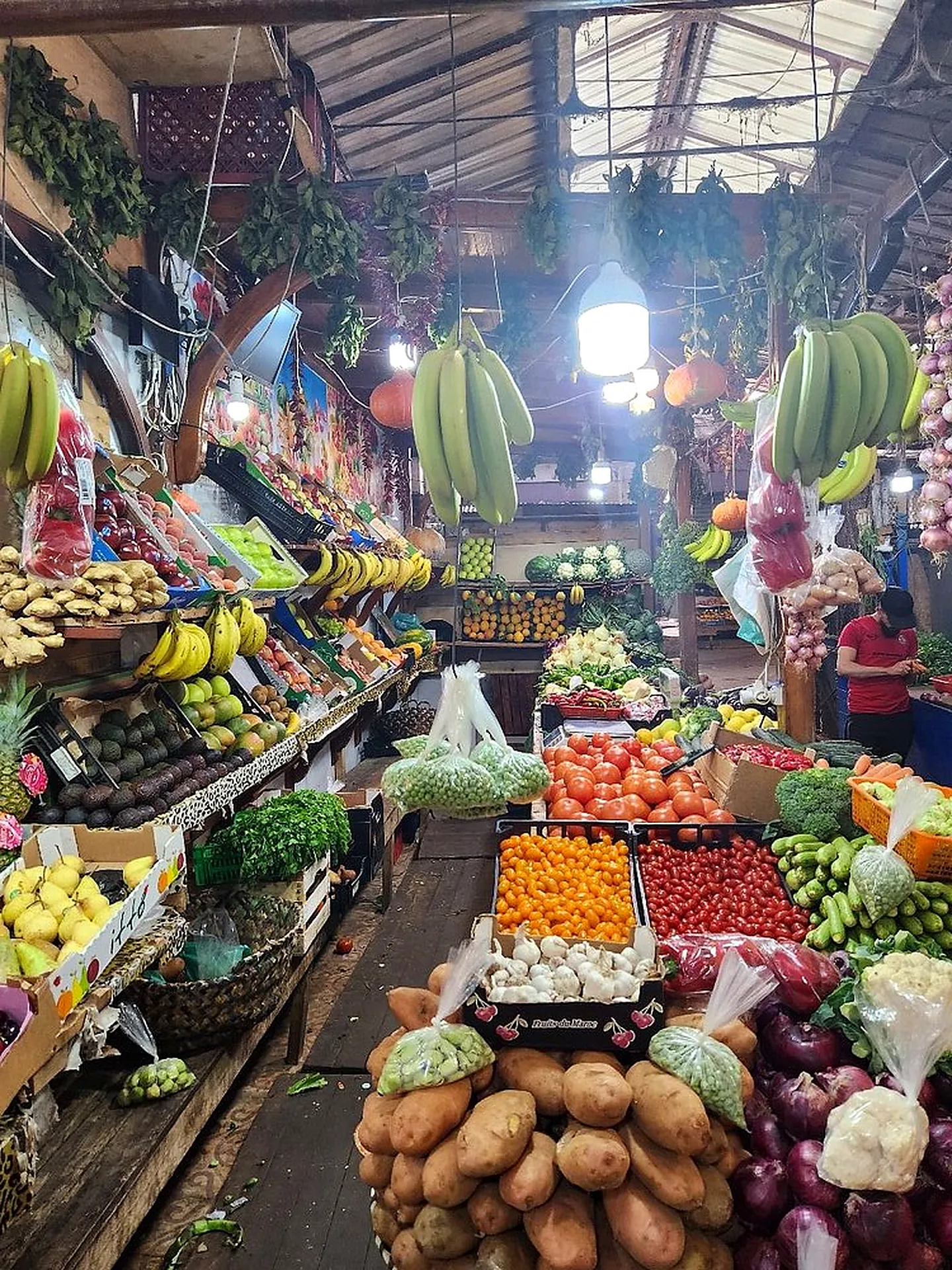Fruit and vegetable stalls in a covered market