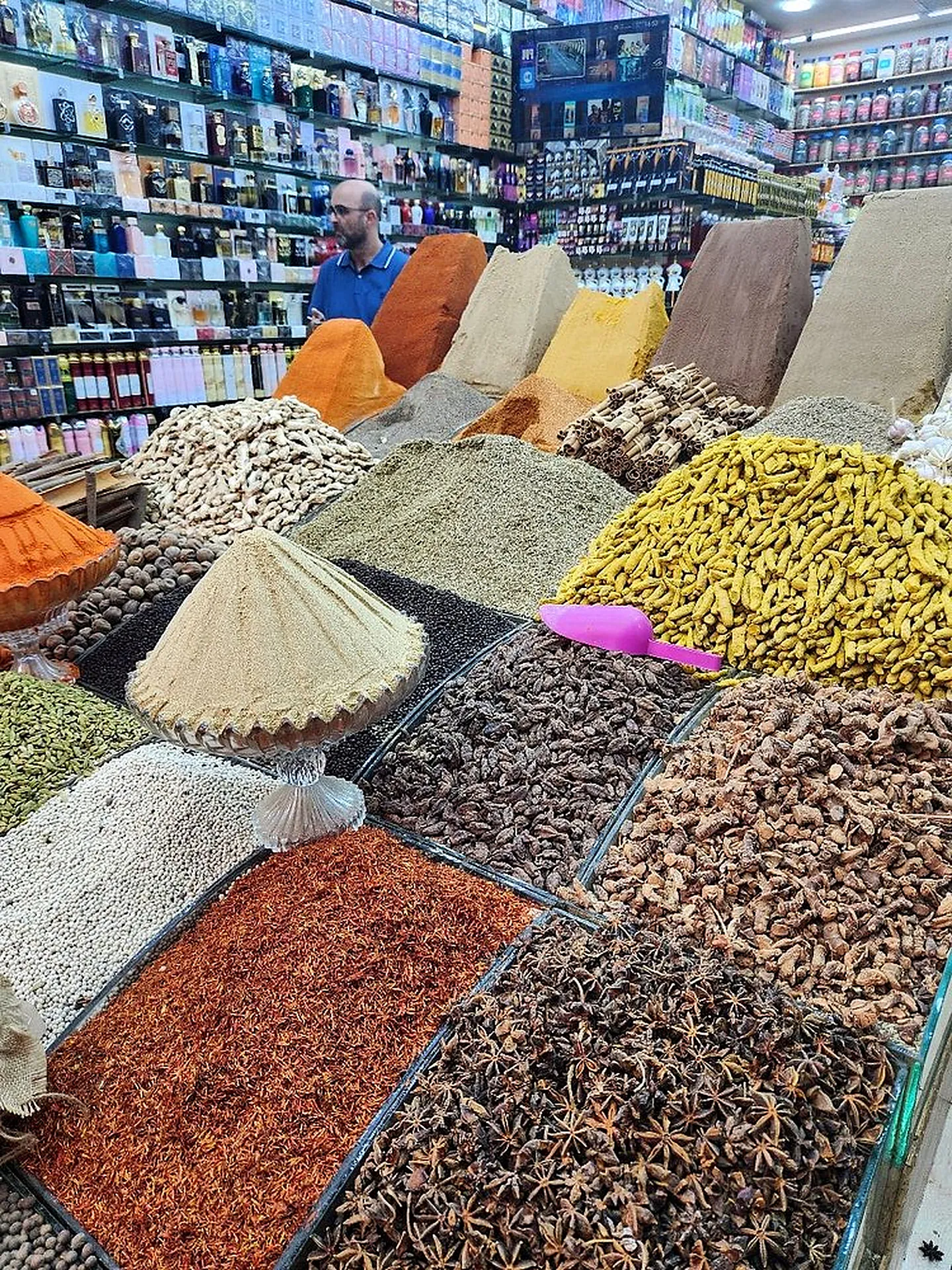 Spices and dried herbs piled high at a souk stall