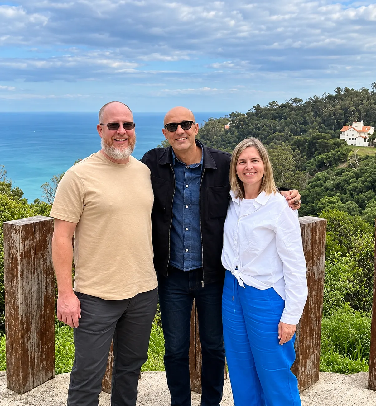 Your guide with two guests at a viewpoint above the sea